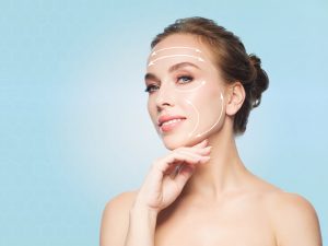 youngwomantouchingherface-web